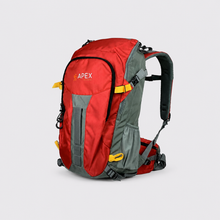 Load image into Gallery viewer, A red and gray Apex hiking backpack with yellow accents, shown from a three-quarter angle on a light gray background.