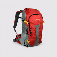 Load image into Gallery viewer, A red and gray Apex hiking backpack with yellow accents, shown from a three-quarters angle on a light gray background.