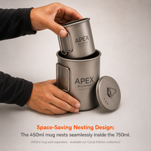 Load image into Gallery viewer, A person's hands demonstrate the space-saving nesting design of the APEX Pro Series camping cookware, stacking a 450ml mug inside a 750ml pot, with the lid placed beside them on a light gray background.