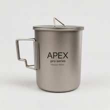 Load image into Gallery viewer, APEX pro series titanium camping mug with a lid and integrated handle, 450ml size, set against a light gray background.