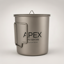 Load image into Gallery viewer, APEX titanium camping pot 750ML featuring a matte gray finish, a fold-out handle, and a matching lid with a loop handle, shown on a light gray background.