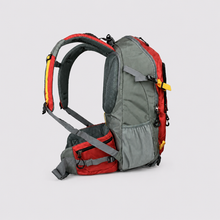 Load image into Gallery viewer, A red and gray hiking backpack with a side hip pouch, shown from a three-quarters angle on a light gray background.
