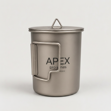 Load image into Gallery viewer, APEX pro series 450ml titanium camping mug with a lid, featuring a metal handle folded in, set against a plain light gray background.
