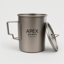 Load image into Gallery viewer, APEX pro series titanium camping mug with a matching lid leaning against it, 450ml capacity, set against a clean light gray background.
