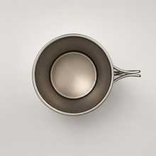 Load image into Gallery viewer, Top-down view of an APEX titanium 450ml mug, featuring a collapsible handle, set against a plain light gray background.
